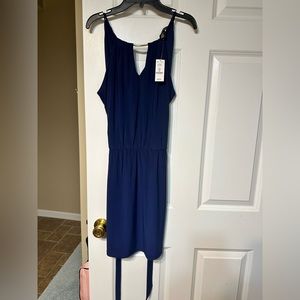 White House Black Market Navy sleeveless dress with and has belted sash. Size XS